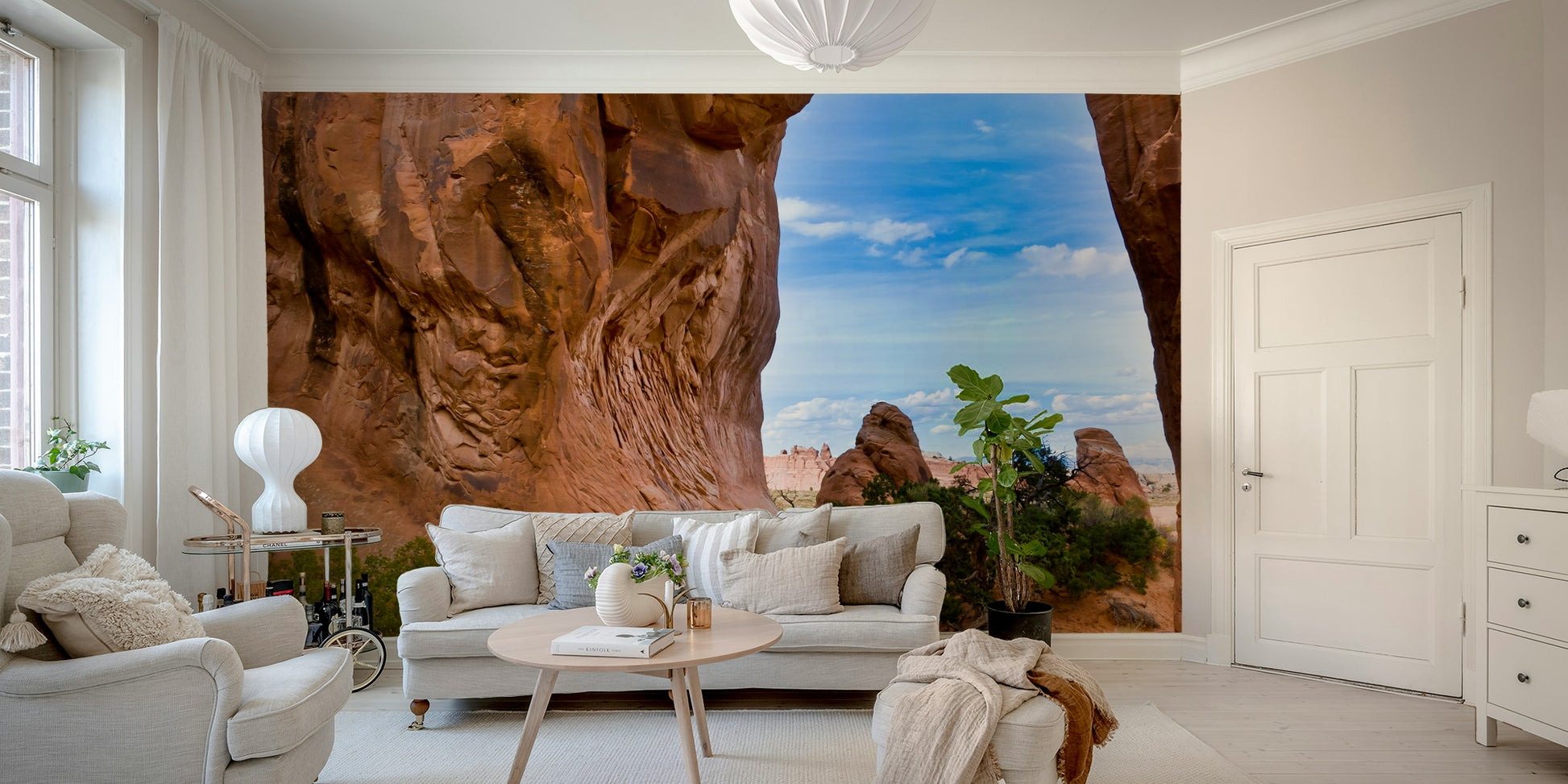 Stone arch with desert landscape mural
