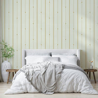 Striped wallpaper in a soft mustard and cream combination.