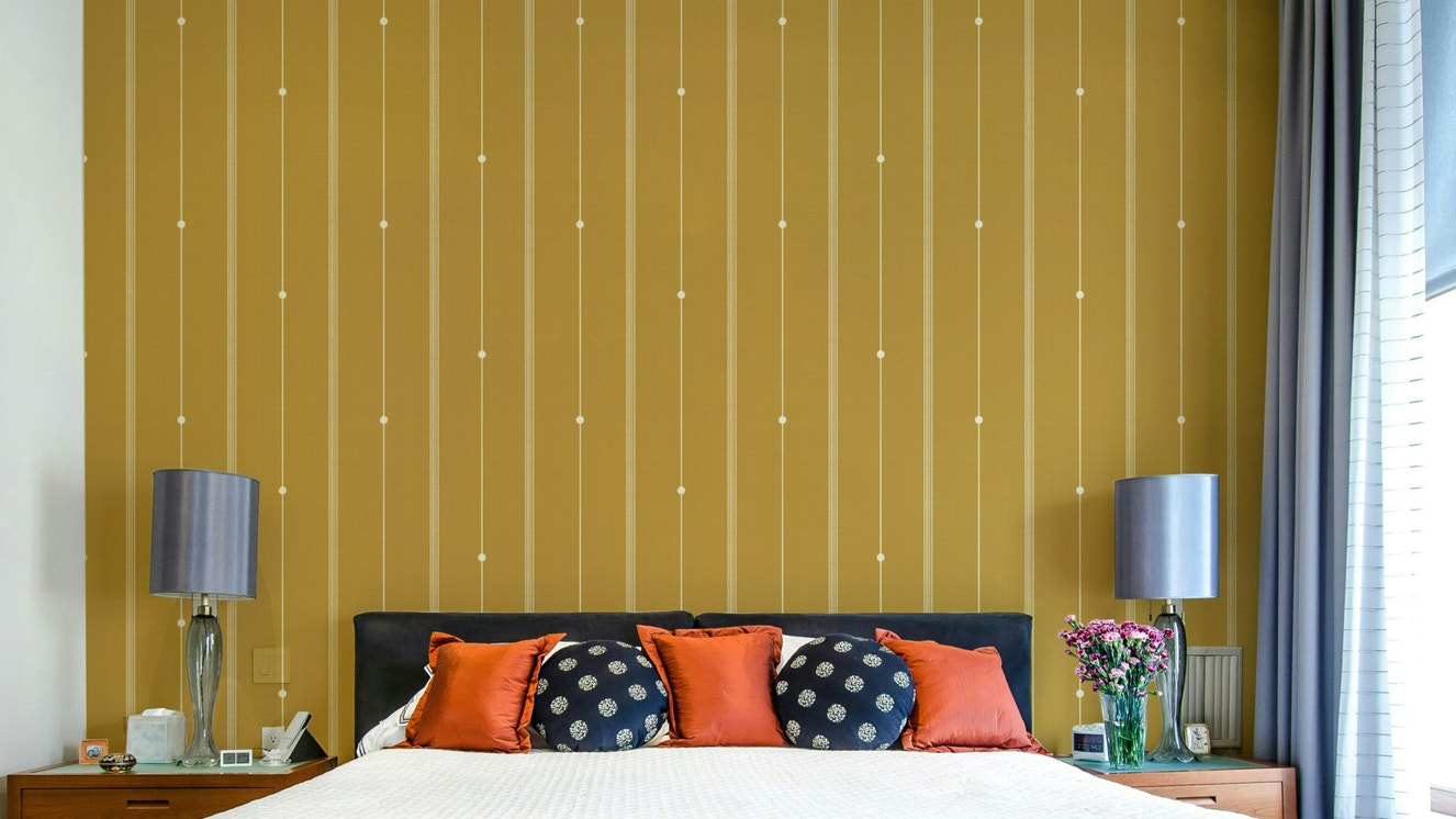 Mustard yellow wallpaper with thin linear stripe design.

