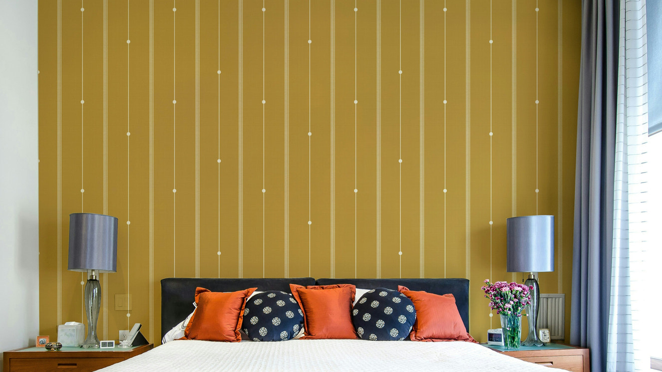 Mustard yellow wallpaper with thin linear stripe design.

