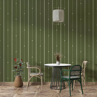 Minimalist green stripe wallpaper behind modern decor elements

