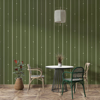 Minimalist green stripe wallpaper behind modern decor elements

