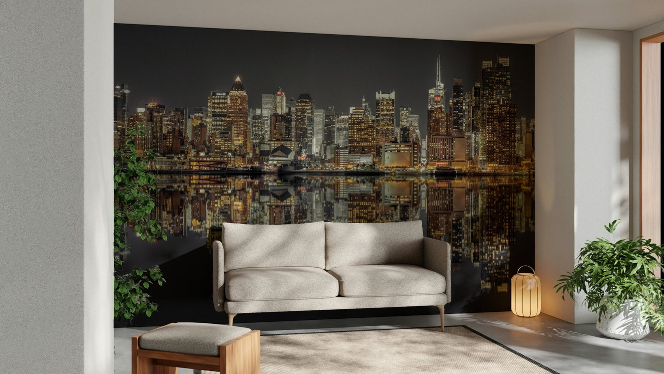 City skyline reflected in water.

