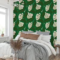 The color palette includes cream florals set against a deep avocado green background.
