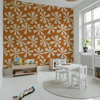 Voracious beige petals on textured orange, Retro Bloom Burst Wallpaper.