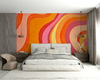 A sunroom decorated with a colorful wavy mural

