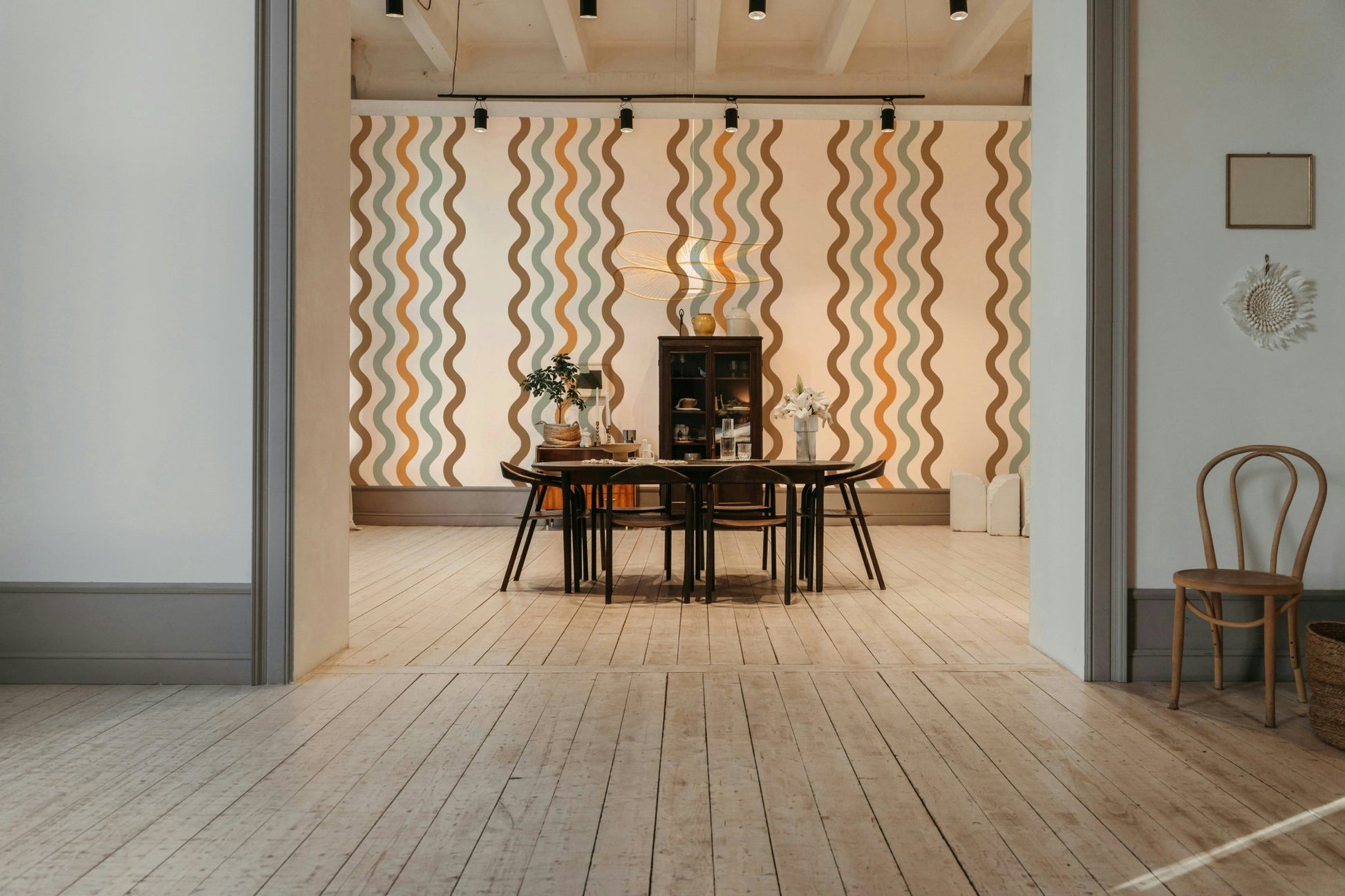 The design features graceful, gentle, horizontal wave lines.


