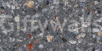 Abstract terrazzo-style wall mural in shades of charcoal and rust.