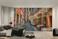 A wall mural featuring a cafe scene in Rome.

