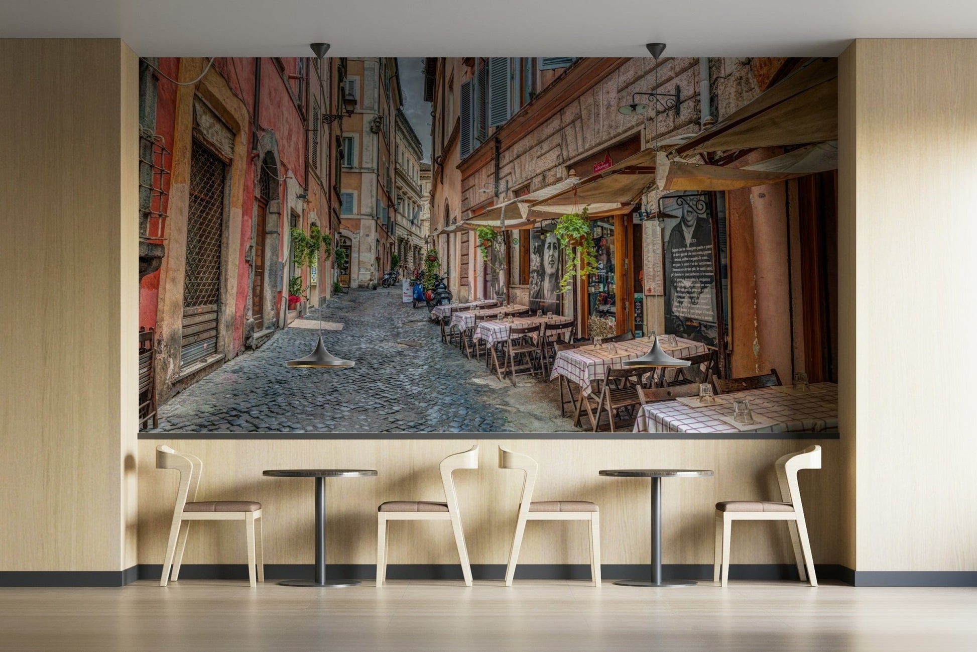 People are sitting at the cafe tables.

