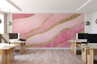Elegant pink wallpaper design featuring glittering gold lines


