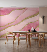 Artistic pink wall design with gold glitter river-like lines

