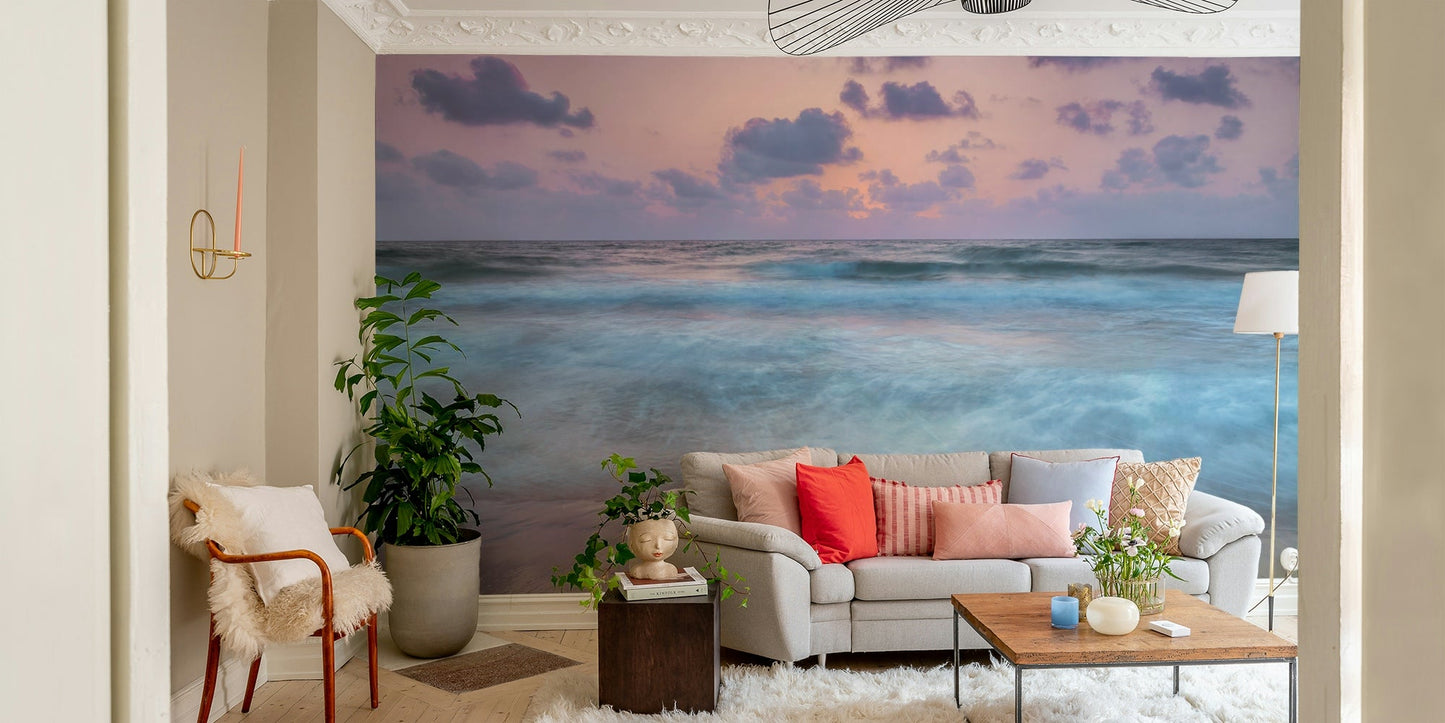 The sand is a wet, reflective beige color.

