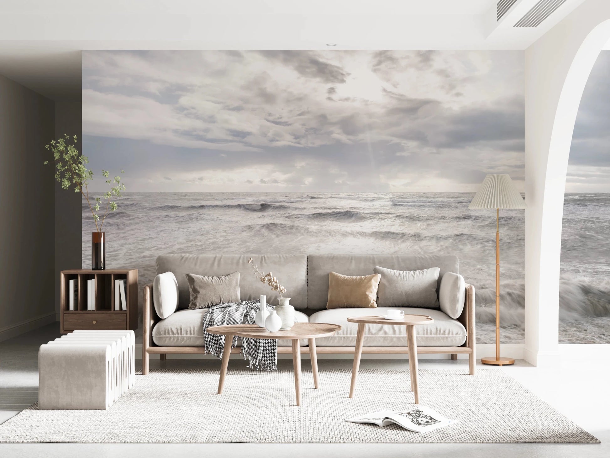 Minimal living room framed by Rough Stormy Sea Wall Mural in soft gray waves
