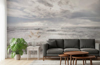 Open-plan living space highlights Rough Stormy Sea Wall Mural with wide horizon