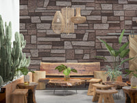 Cozy reading nook accented by the Rustic Brickwork Charm Wall Mural.