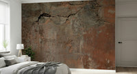 A hand applying the Rustic Earth Tones warm abstract mural.