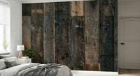 Installation image of the simple-to-use Rustic Wood Plank peel and stick wallpaper.