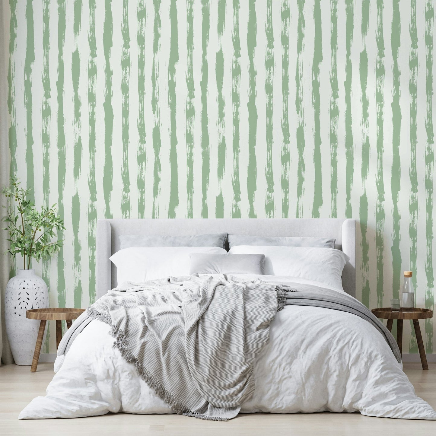 Wallpaper with a gentle sage green and white stripe design

