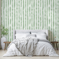 Wallpaper with a gentle sage green and white stripe design

