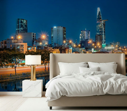 A modern bedroom anchored by Saigon Skyline Night Wall Mural and glowing city lights