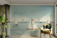 Wall mural with a sailboat and a calm ocean

