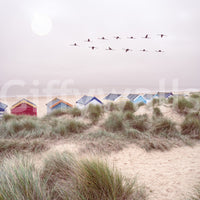 Peaceful oceanfront mural with sand and gentle waves

