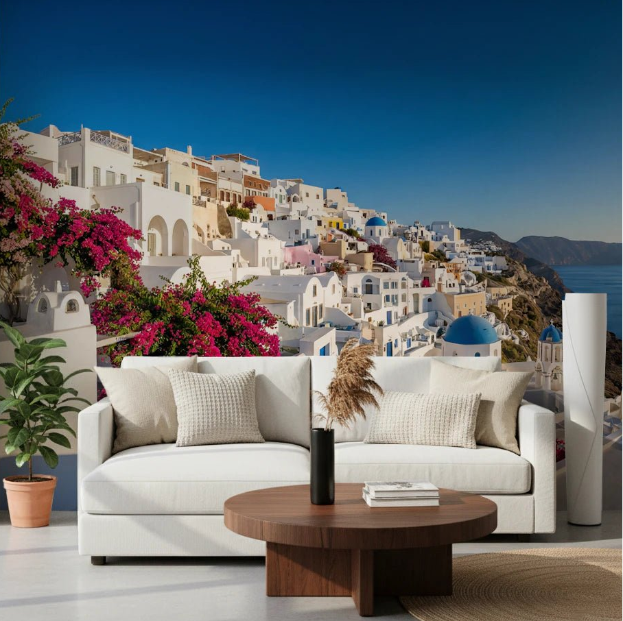 Living room styled with Santorini Dreamscape wall mural and bright coastal view