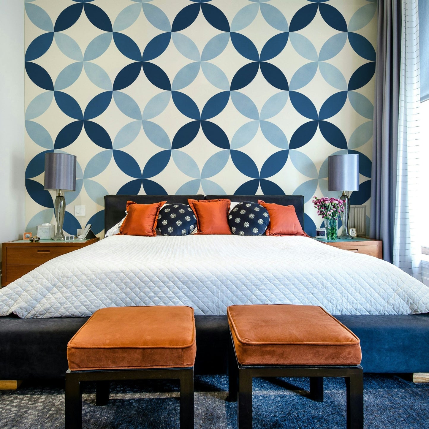 The color palette uses rich sapphire blue and navy tones.

