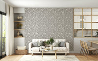 Neutral Scandinavian foliage wallpaper, graceful repeating bird elements.