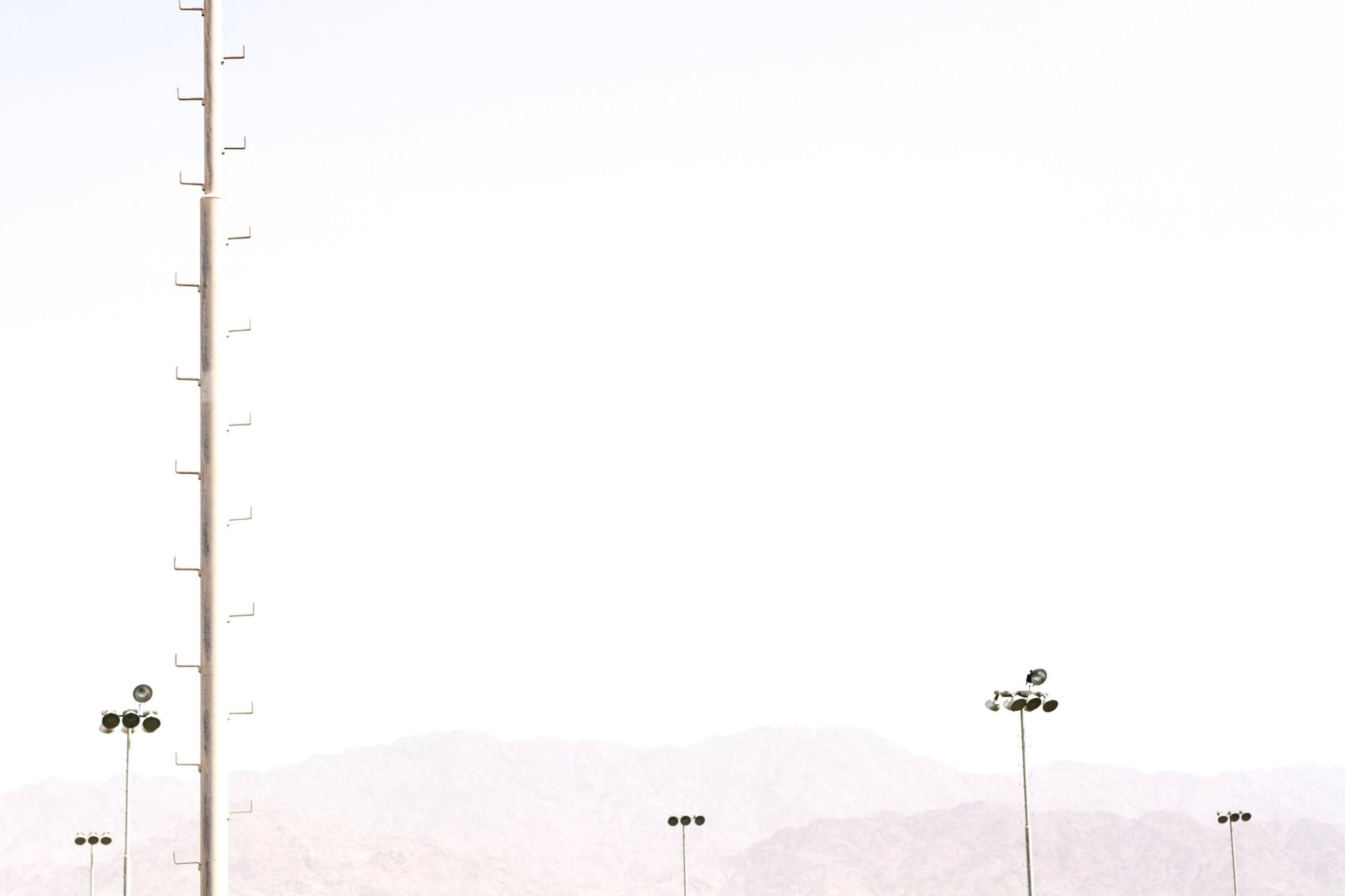 Milky sky frames the tall floodlight stands in this Eilat #32 wall mural GD4802
