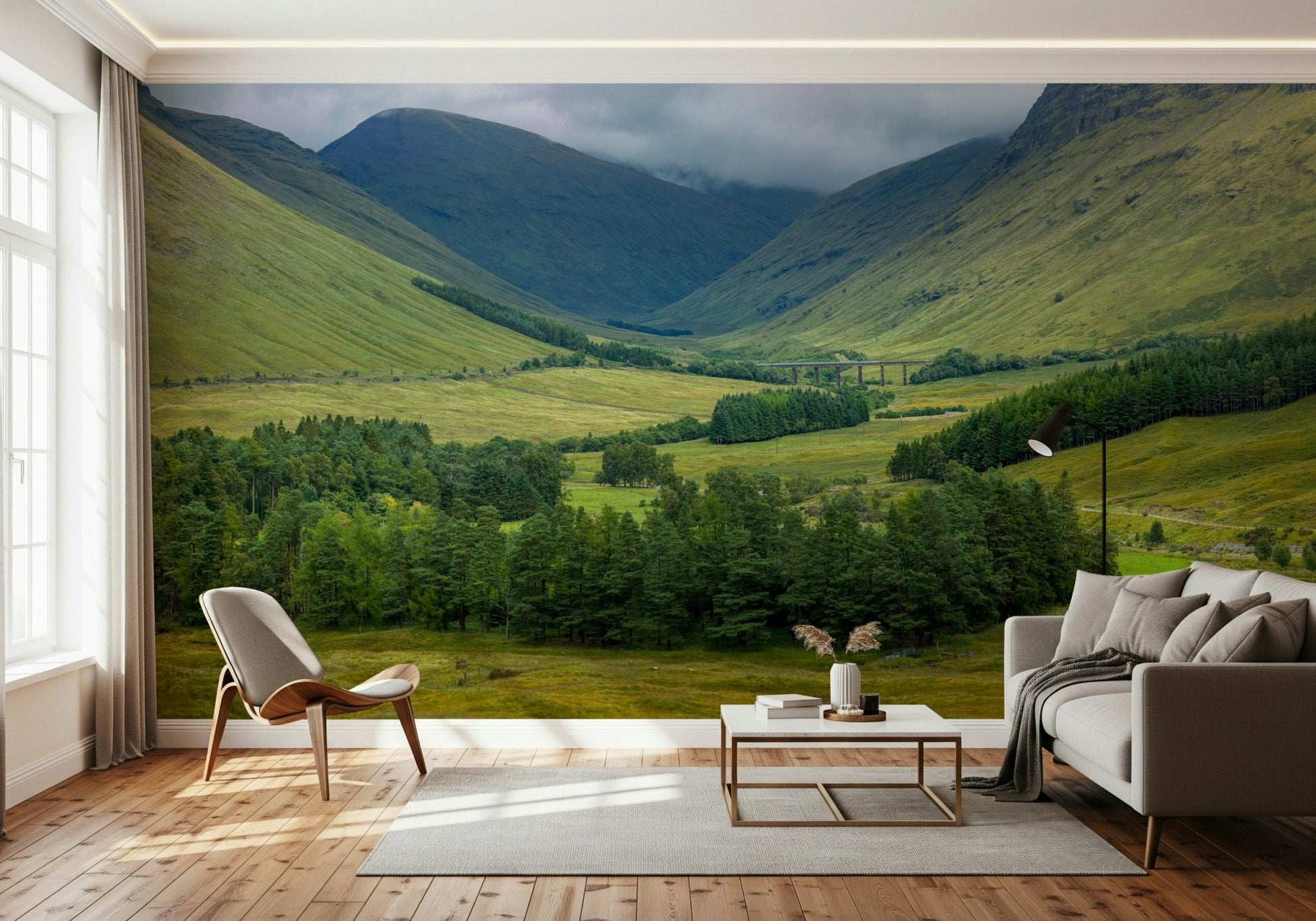 Scottish Highlands Vista Wall Mural behind a comfortable seating area.