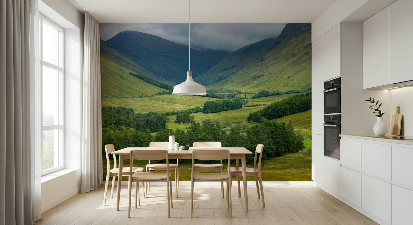 Lush green slopes and cloudy sky of Scottish Highlands Vista Wall Mural.