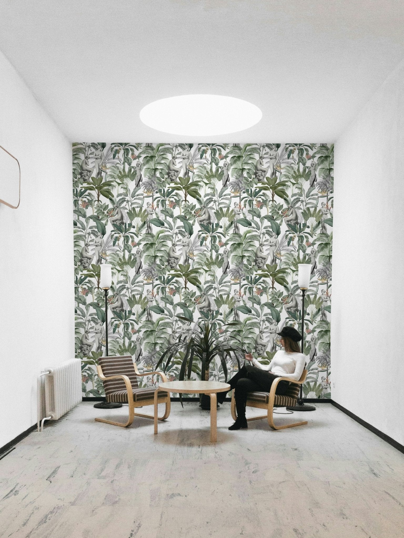 Lush green and neutral-toned tropical wallpaper with bold form

