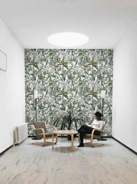 Lush green and neutral-toned tropical wallpaper with bold form

