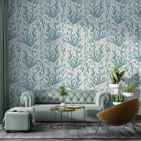 A close-up of a colorful fish and coral pattern on wallpaper.

