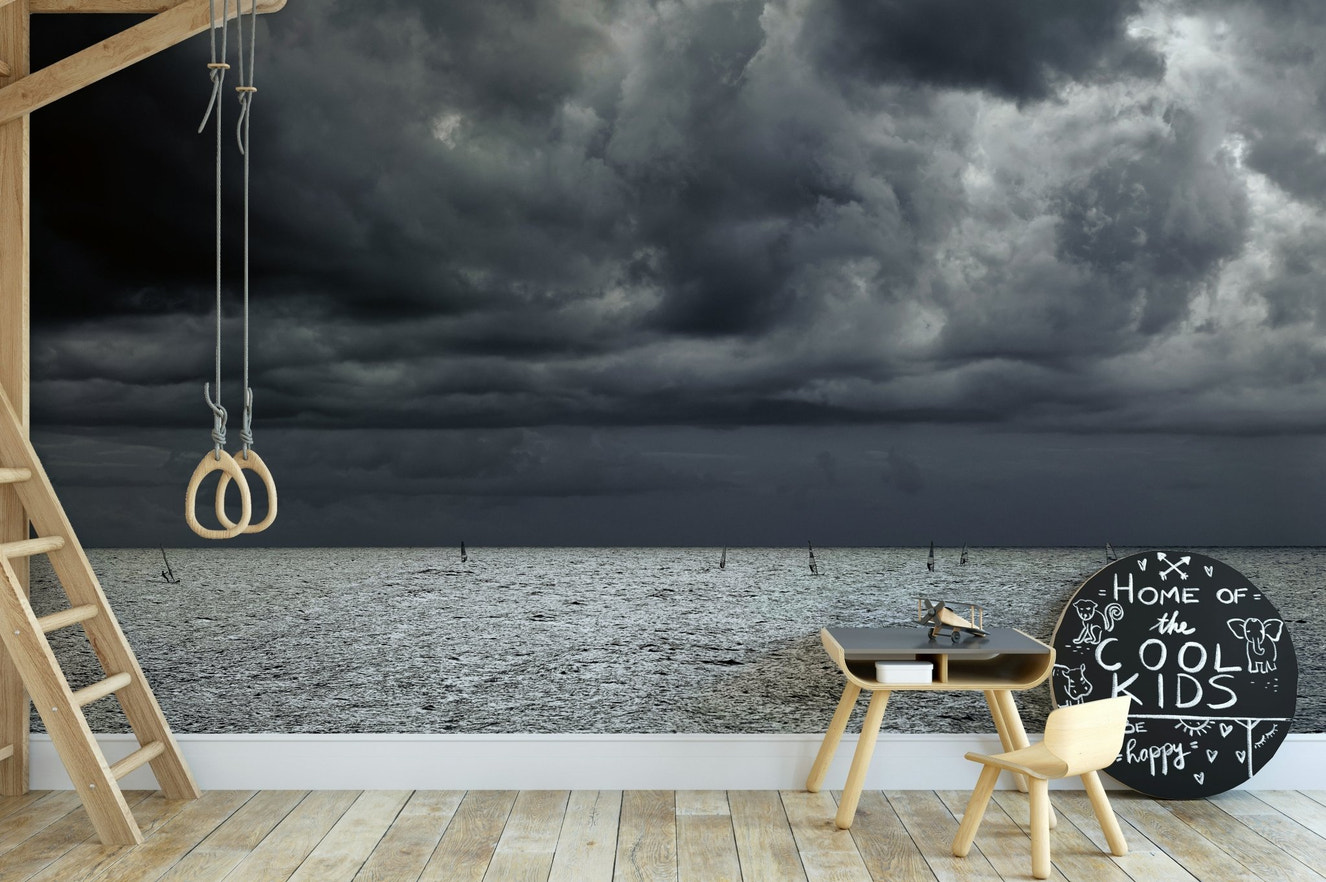 A beautiful coastal rock wallpaper mural with crashing waves.

