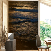 A graceful wave motion wall mural in cool, natural tones.

