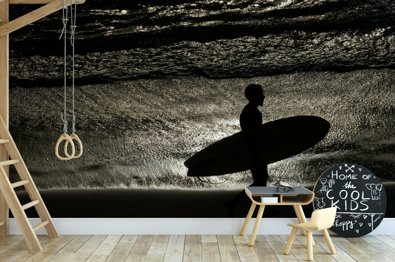 A beautiful coastal rock wallpaper mural with crashing waves.

