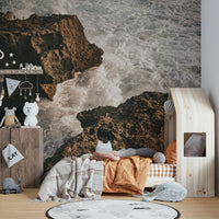 A detail shot of the sea foam and rock textures.