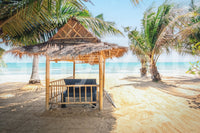 Peaceful shore view wall mural with a rustic bamboo cabana.