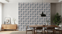 Dining setup placed in front of Serene Blooms Wallpaper with simple wooden table