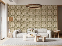 A low white sofa sits against Serene Botanical Rustic Monstera Wallpaper
