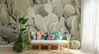 Serene cactus cluster wall mural as a backdrop for a dining space.