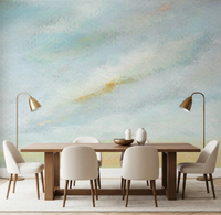 Serene Sky Whisper Wall Mural brings soft blue watercolor vibes to this dining area.