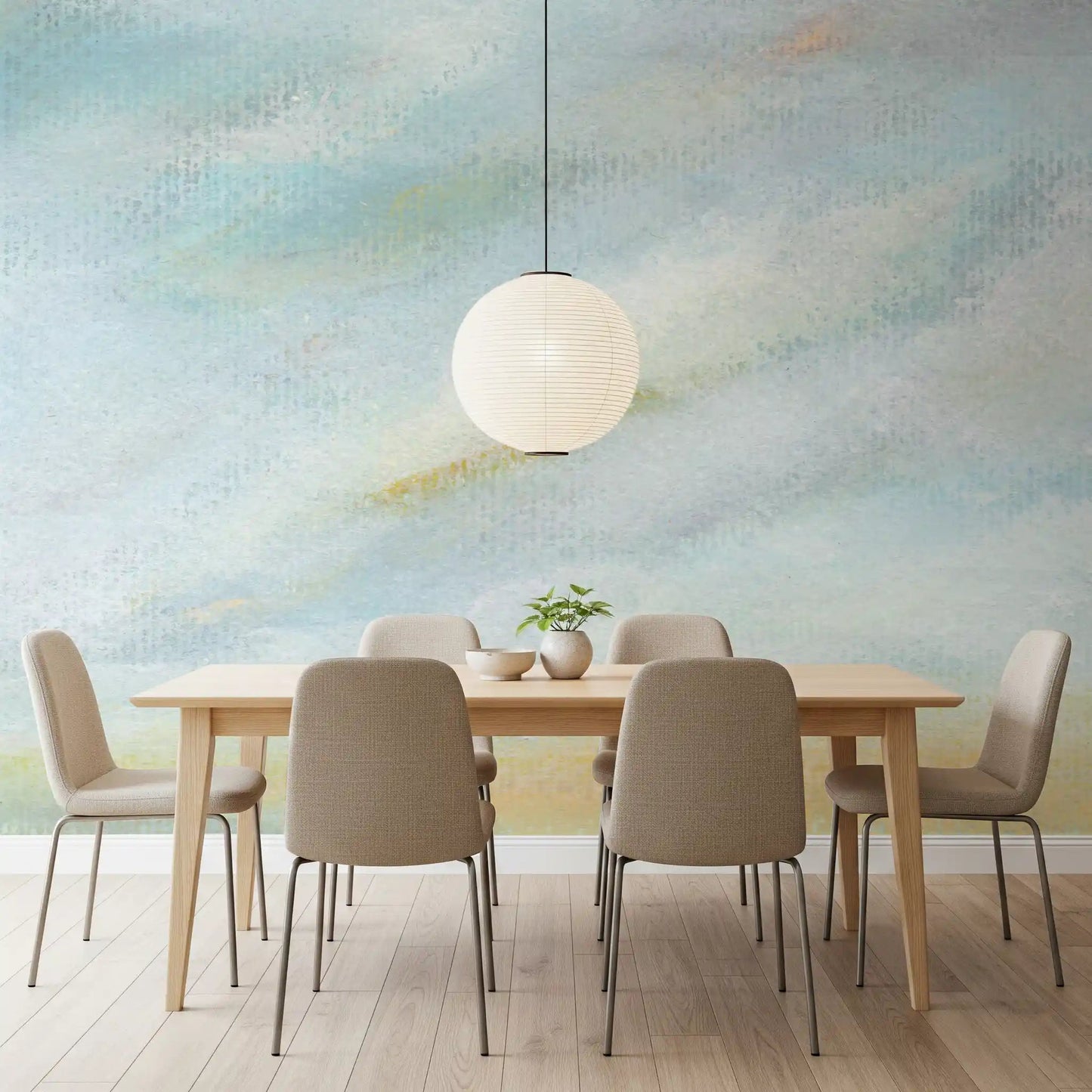 Quiet blue tones of the Serene Sky Whisper Wall Mural fill this light dining space.