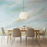 Quiet blue tones of the Serene Sky Whisper Wall Mural fill this light dining space.