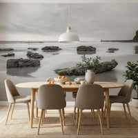 Dining room shows Shoreline Hues wall mural with calm sea view