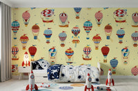 An artistic soft focus balloon mural on minimalist wallpaper.