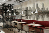 The scene includes a perfect reflection of the city in a body of water.

